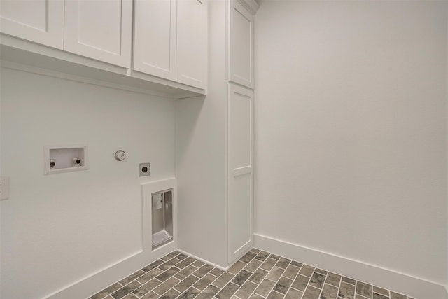 laundry room featuring hookup for a washing machine, electric dryer hookup, and cabinets