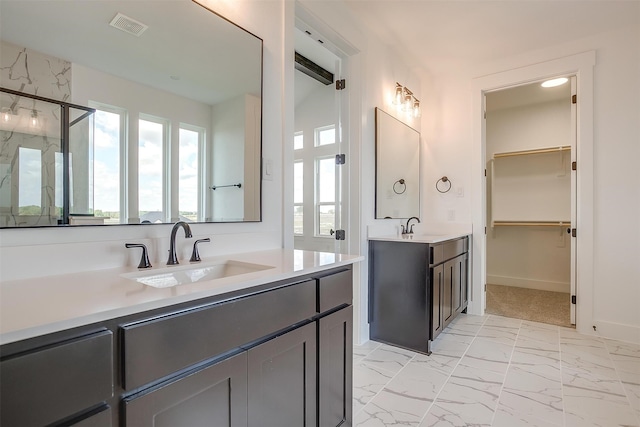 bathroom featuring an enclosed shower and vanity