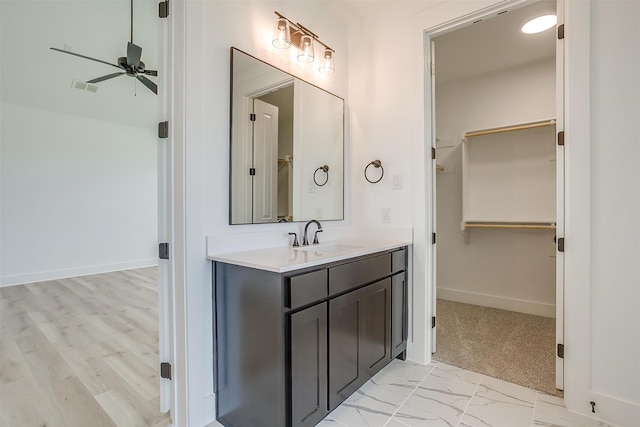 bathroom featuring vanity, ceiling fan, and hardwood / wood-style flooring