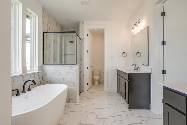 full bathroom with vanity, toilet, plus walk in shower, and tile walls