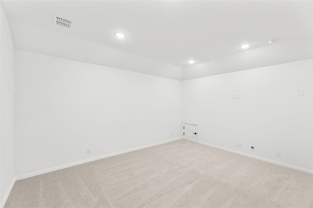 empty room featuring light carpet