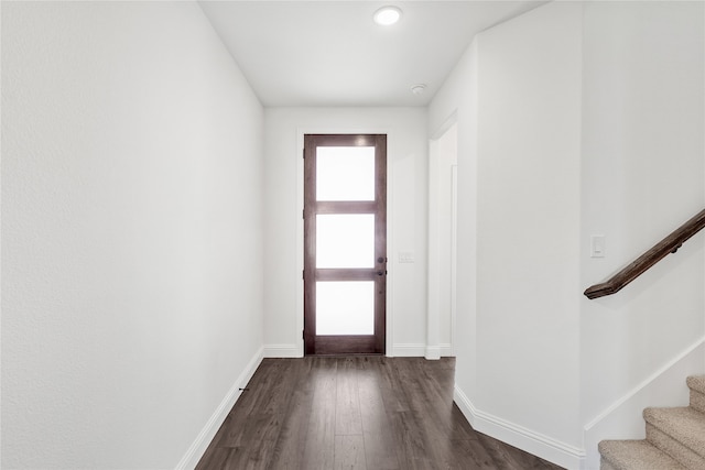 foyer entrance with dark hardwood / wood-style flooring