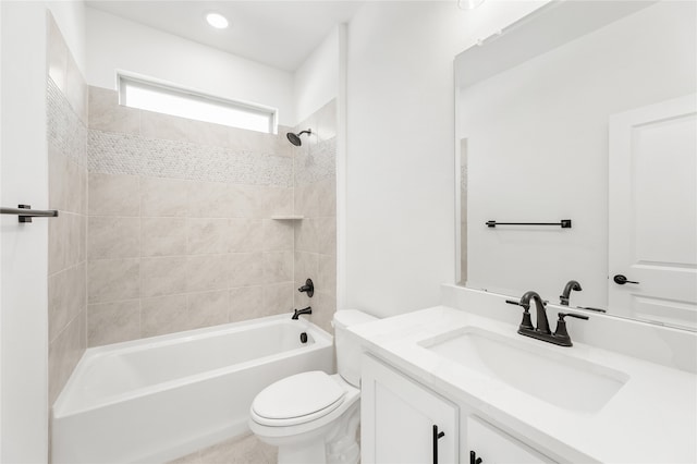 full bathroom with vanity, toilet, and tiled shower / bath