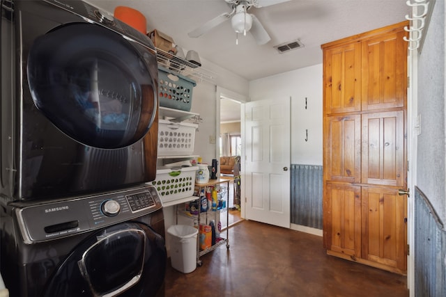 washroom with ceiling fan and stacked washer and dryer