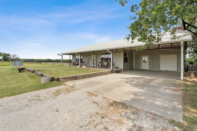 view of front of home featuring a front yard, a porch, and a garage