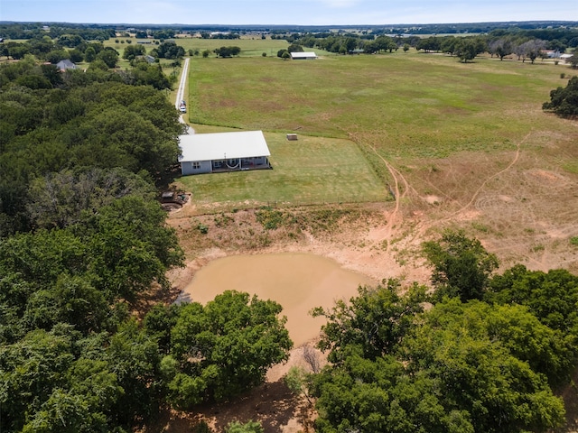 birds eye view of property with a rural view and a water view