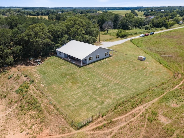 birds eye view of property with a rural view