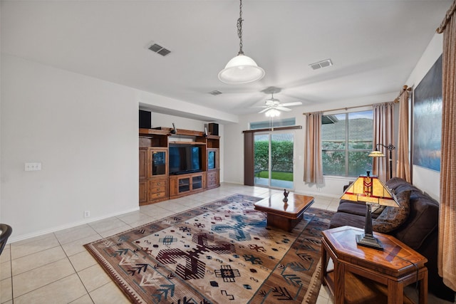 tiled living room with ceiling fan