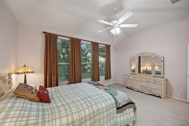 bedroom featuring ceiling fan, light colored carpet, and lofted ceiling