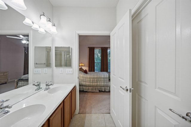 bathroom featuring tile patterned floors, ceiling fan, and vanity