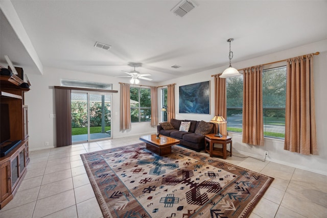 tiled living room featuring ceiling fan