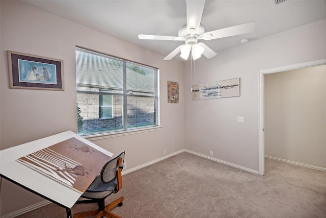 unfurnished office with light colored carpet and ceiling fan