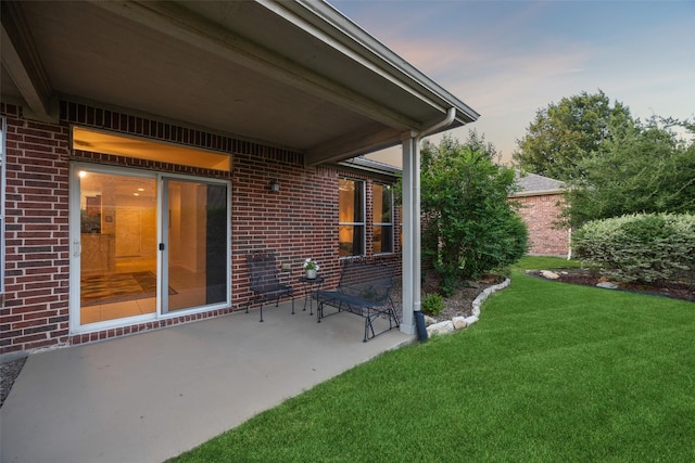 patio terrace at dusk with a lawn