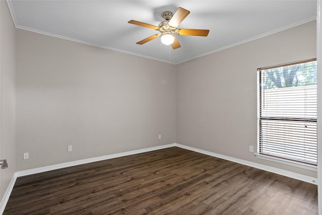 spare room with a healthy amount of sunlight, dark hardwood / wood-style flooring, ceiling fan, and ornamental molding