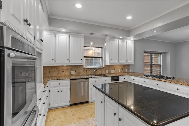 kitchen featuring sink, ornamental molding, white cabinets, and appliances with stainless steel finishes