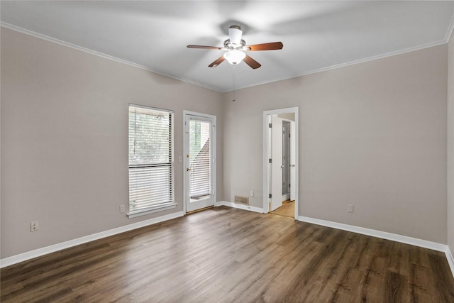 unfurnished room featuring ceiling fan, crown molding, and dark hardwood / wood-style floors