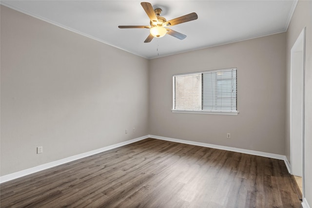 spare room featuring ceiling fan, wood-type flooring, and crown molding