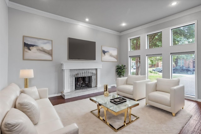 living room with ornamental molding and hardwood / wood-style floors