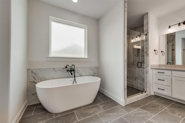 bathroom featuring vanity and plus walk in shower