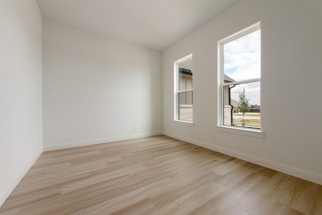 unfurnished room featuring light hardwood / wood-style flooring