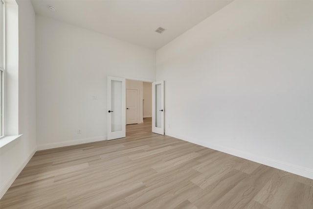 spare room with light wood-type flooring