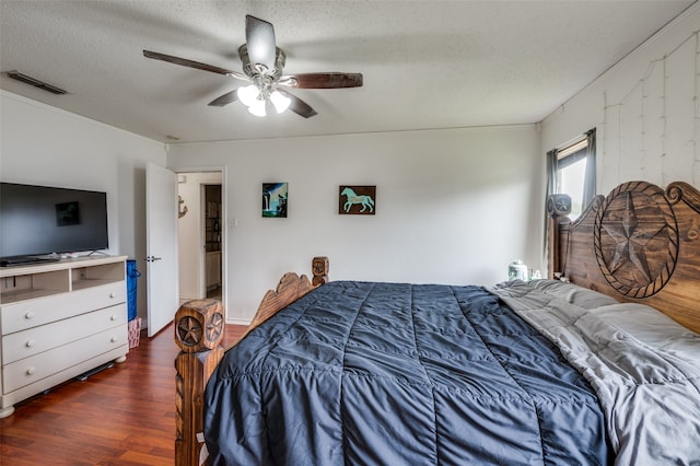 bedroom with wood-type flooring, ceiling fan, and a textured ceiling