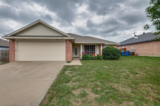 ranch-style house featuring a garage and a front lawn