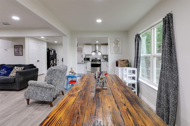 dining area with light wood-type flooring