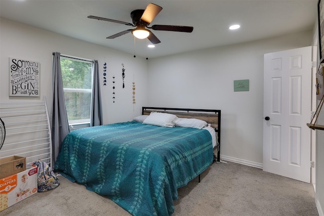 carpeted bedroom featuring ceiling fan