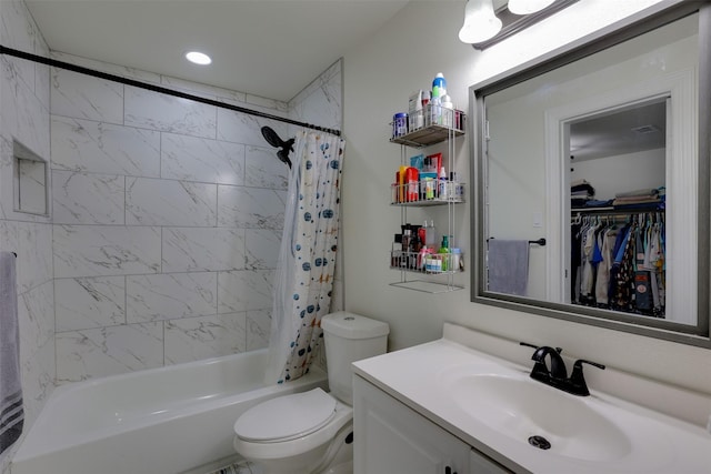 full bathroom featuring vanity, toilet, and shower / tub combo