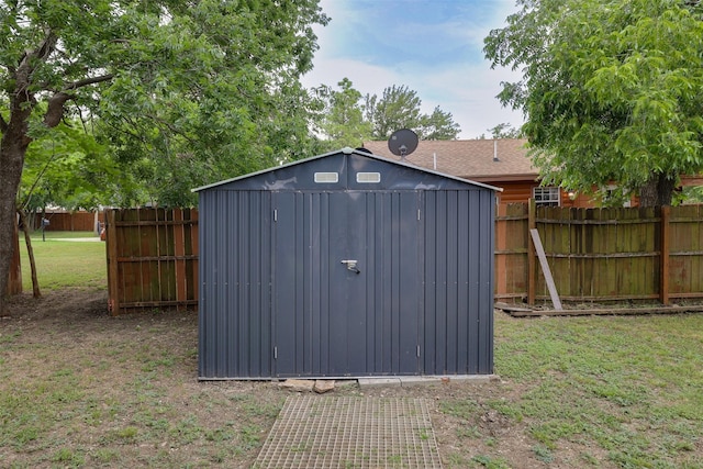 view of outbuilding featuring a yard