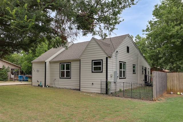 view of property exterior with a yard