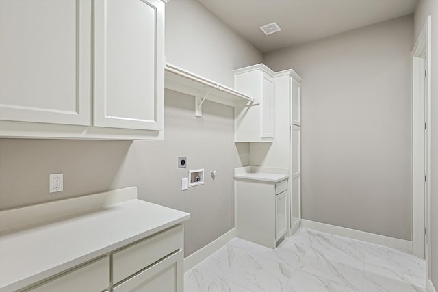 washroom featuring cabinets, hookup for an electric dryer, and hookup for a washing machine