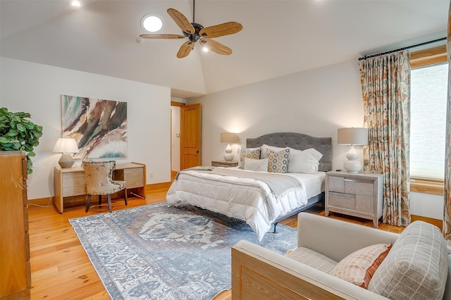 bedroom featuring lofted ceiling, ceiling fan, and light hardwood / wood-style flooring