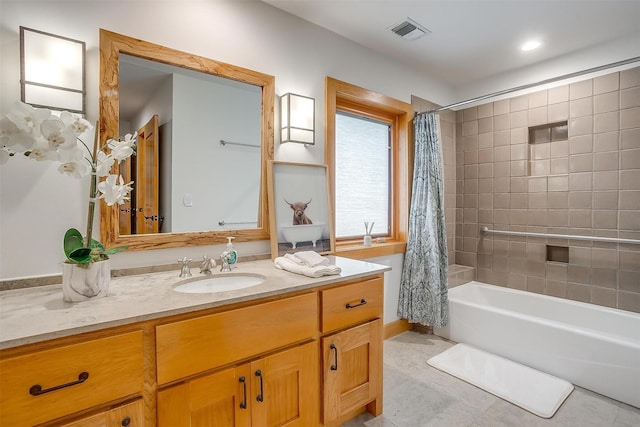 bathroom featuring shower / tub combo, vanity, and tile patterned flooring