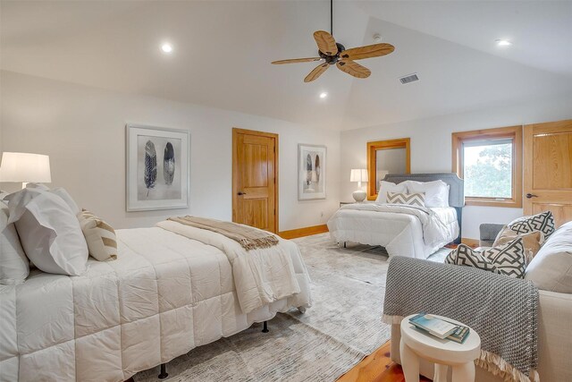 bedroom featuring high vaulted ceiling, hardwood / wood-style flooring, and ceiling fan