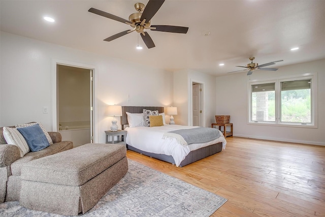 bedroom featuring ensuite bathroom, ceiling fan, and light hardwood / wood-style flooring