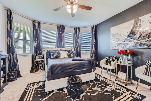 bedroom with ceiling fan and carpet floors