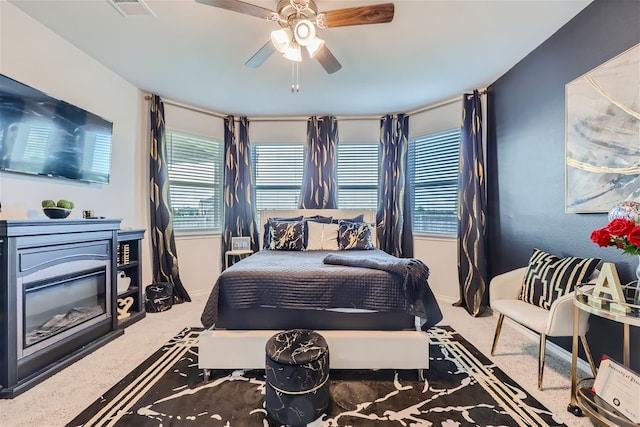 carpeted bedroom with ceiling fan