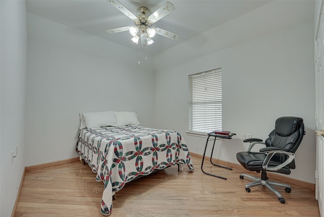 bedroom featuring light wood-type flooring and ceiling fan