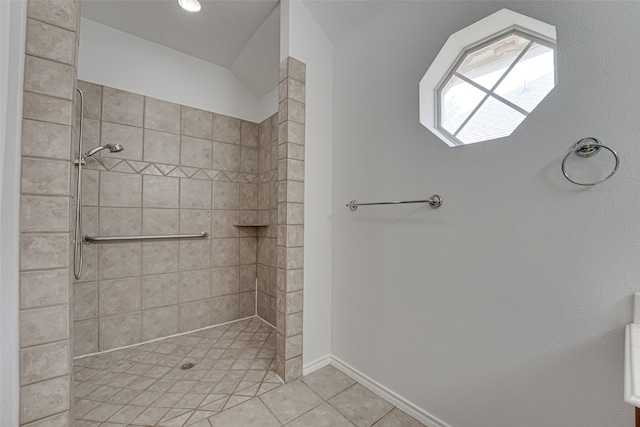 bathroom featuring a tile shower and tile floors