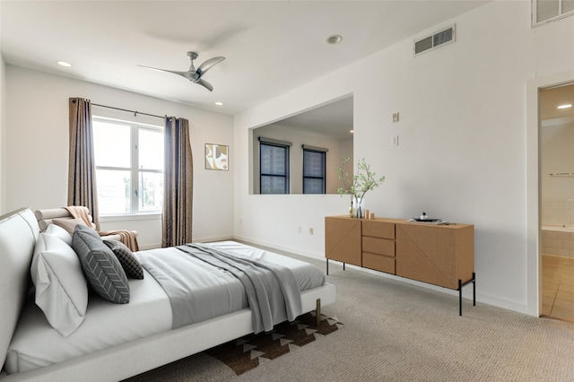 carpeted bedroom featuring connected bathroom and ceiling fan