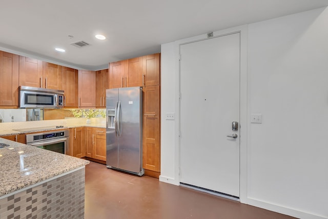 kitchen with stainless steel appliances, backsplash, visible vents, light stone countertops, and finished concrete floors