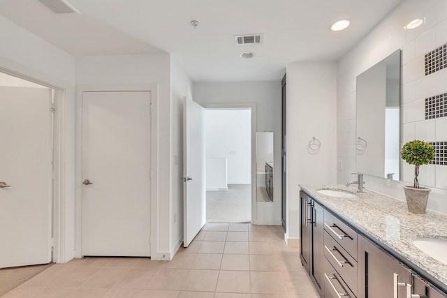 full bathroom with a sink, double vanity, tile patterned flooring, visible vents, and recessed lighting