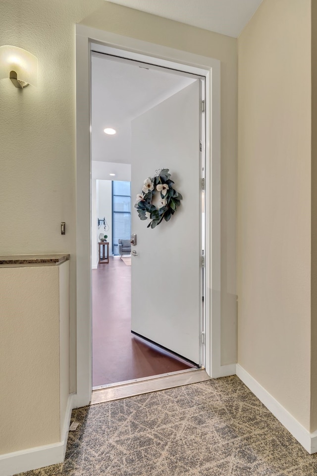 interior space featuring baseboards