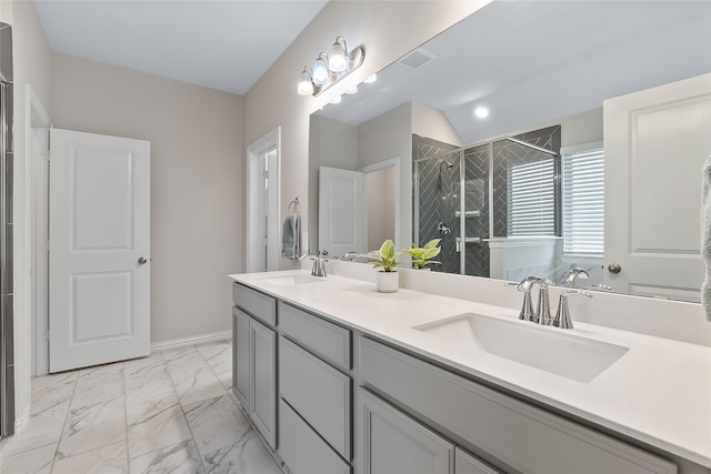 bathroom with vanity and a shower with shower door