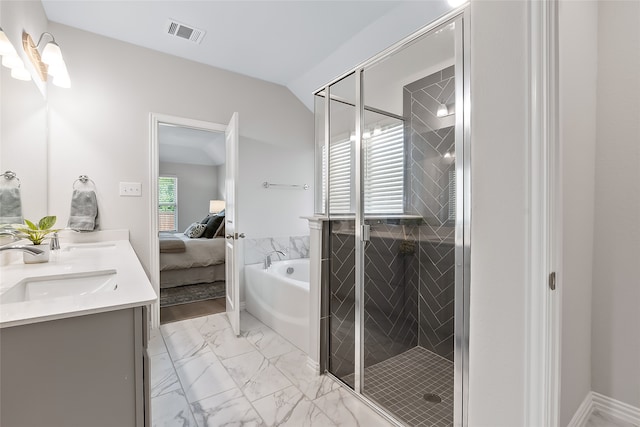 bathroom with vanity, separate shower and tub, and lofted ceiling