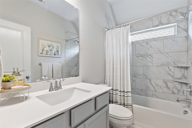 full bathroom featuring shower / tub combo, vanity, and toilet