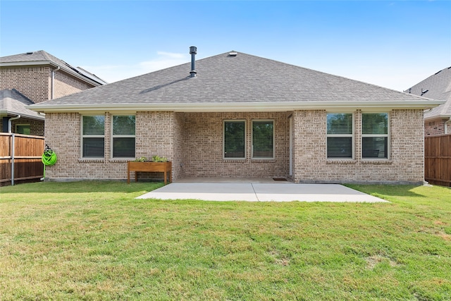 back of house featuring a yard and a patio