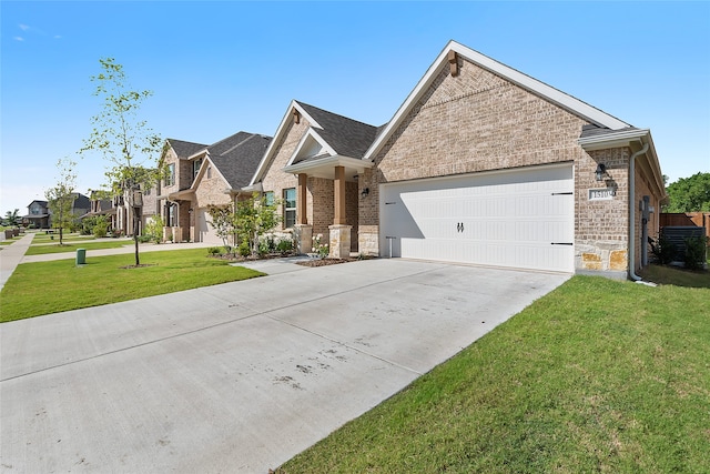 view of front of home featuring a garage and a front lawn